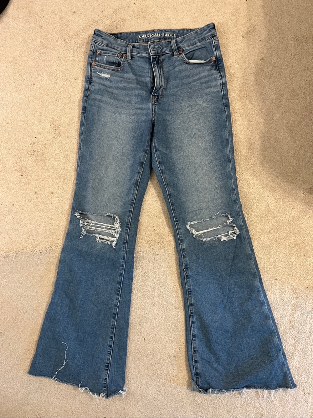 American Eagle Outfitters Distressed Flare Jeans in Medium Blue